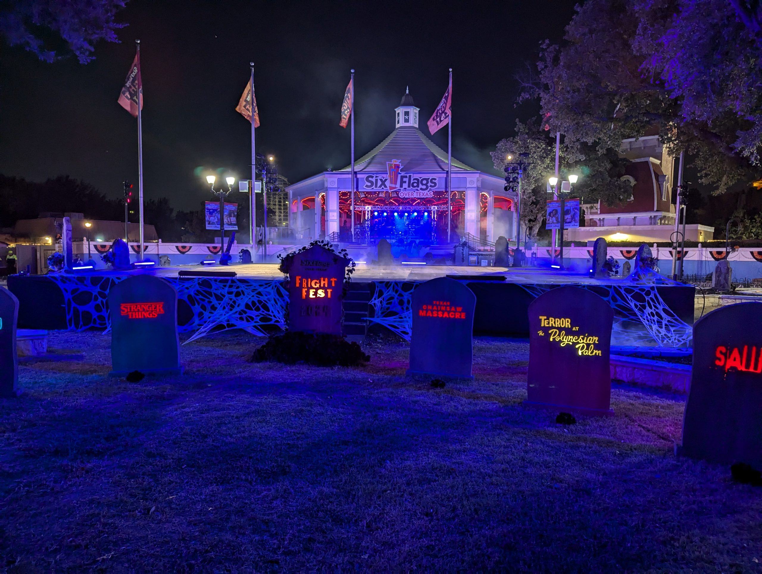 Black stage built over a fountain, designed as a sleek promotional platform with clean coverage and visual appeal