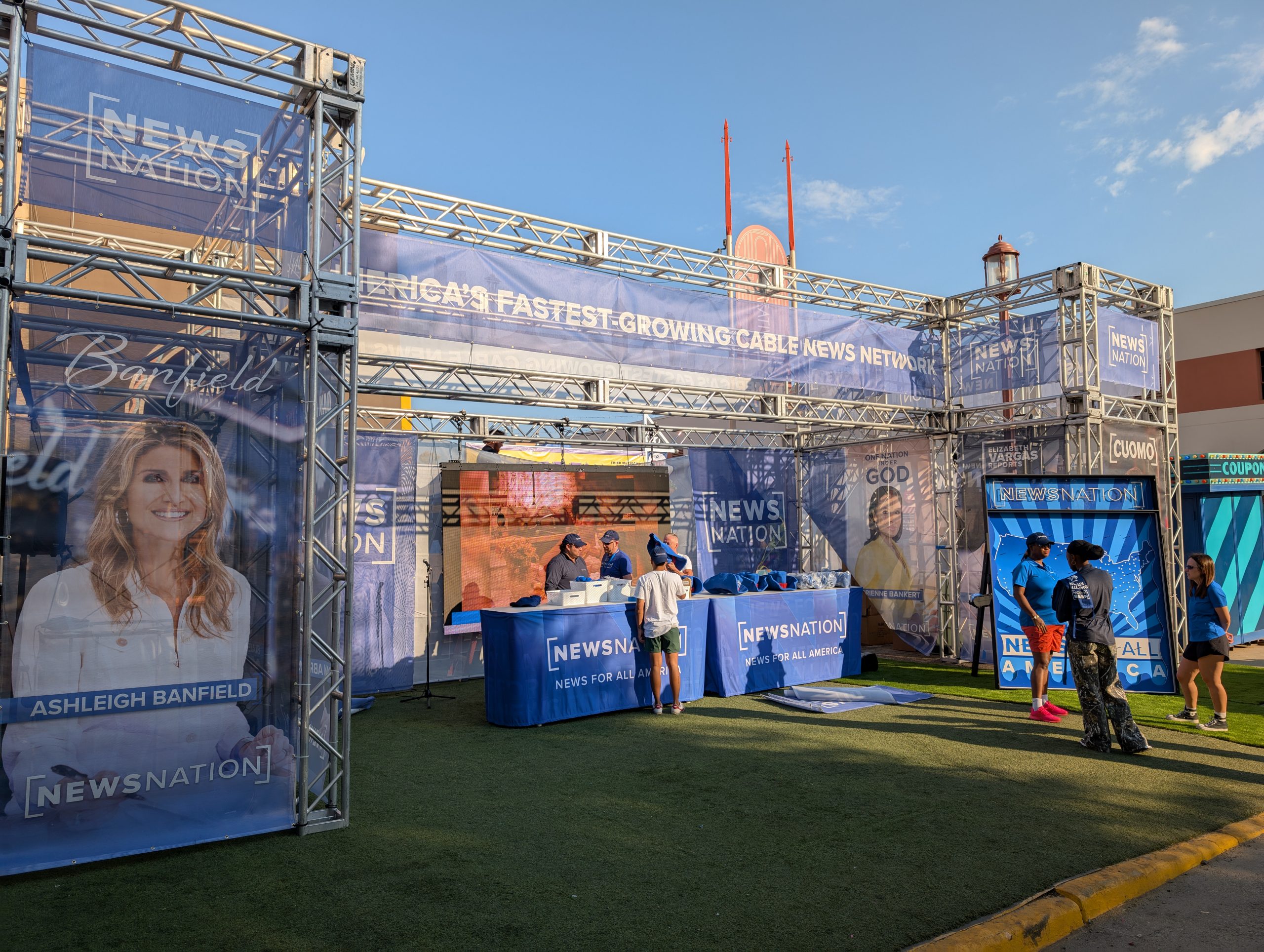 Custom-built truss structure with full rooftop coverage, maximizing space for printed branding and sponsor graphics